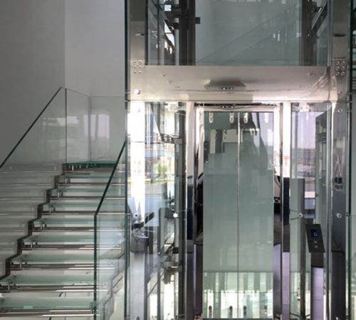 Glass Stainless Steel tower lift and staircase. Glass Staircase