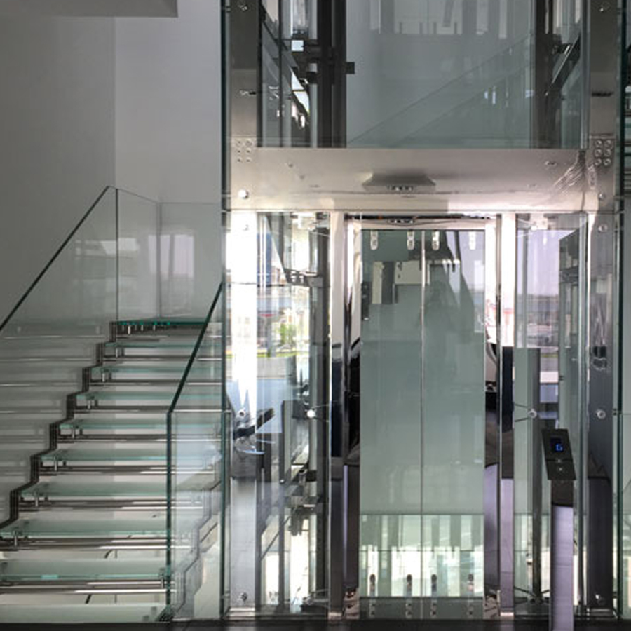 Glass Stainless Steel tower lift and staircase. Glass Staircase